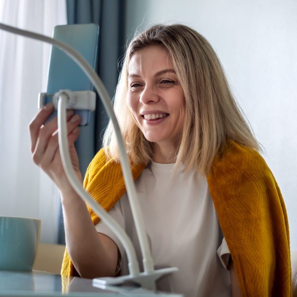 blonde-woman-blogger-influencer-talking-smartphone-live-recording-video-blog-social-network-at-home.jpg